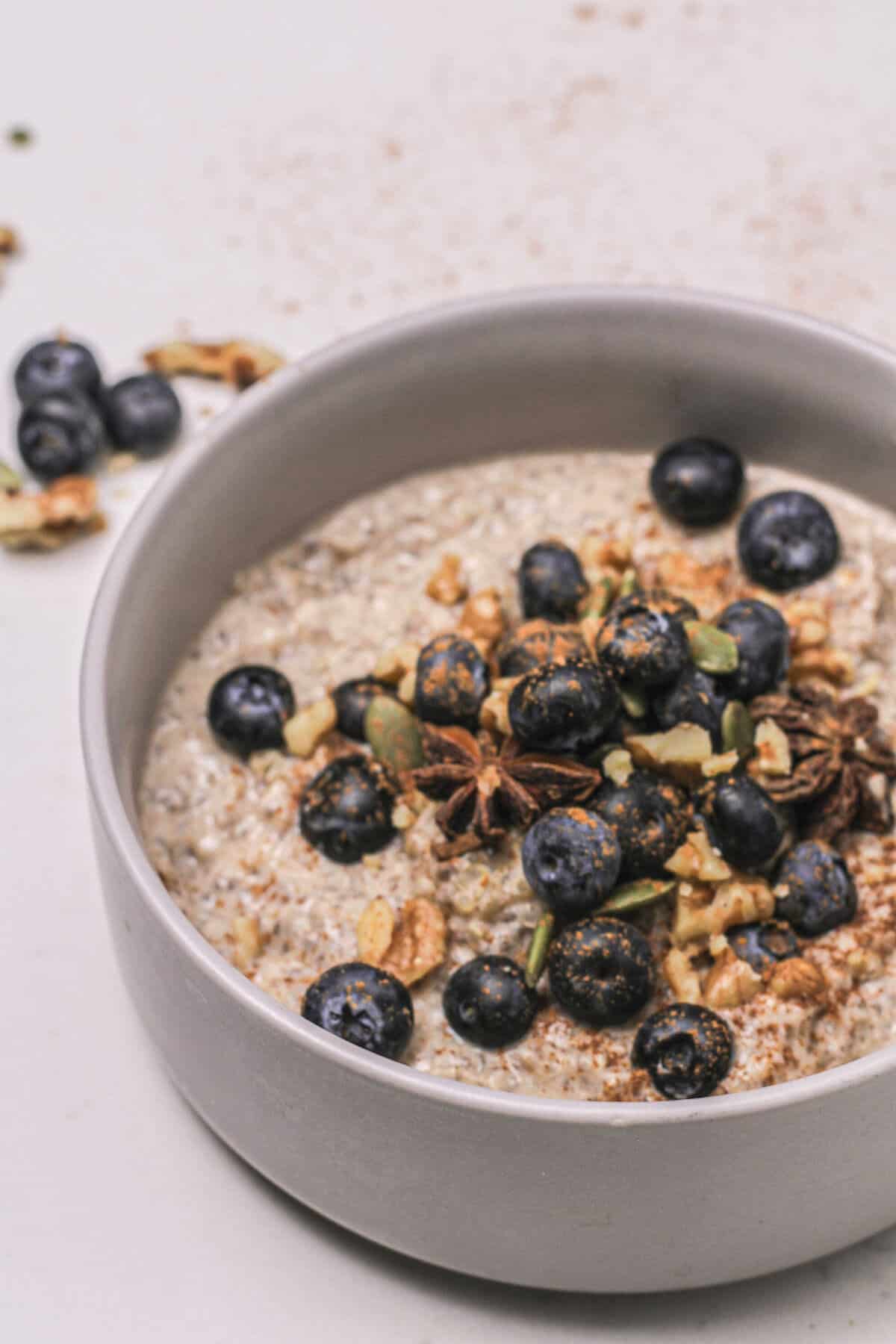 Quinoa porridge in a bowl with berries and nuts