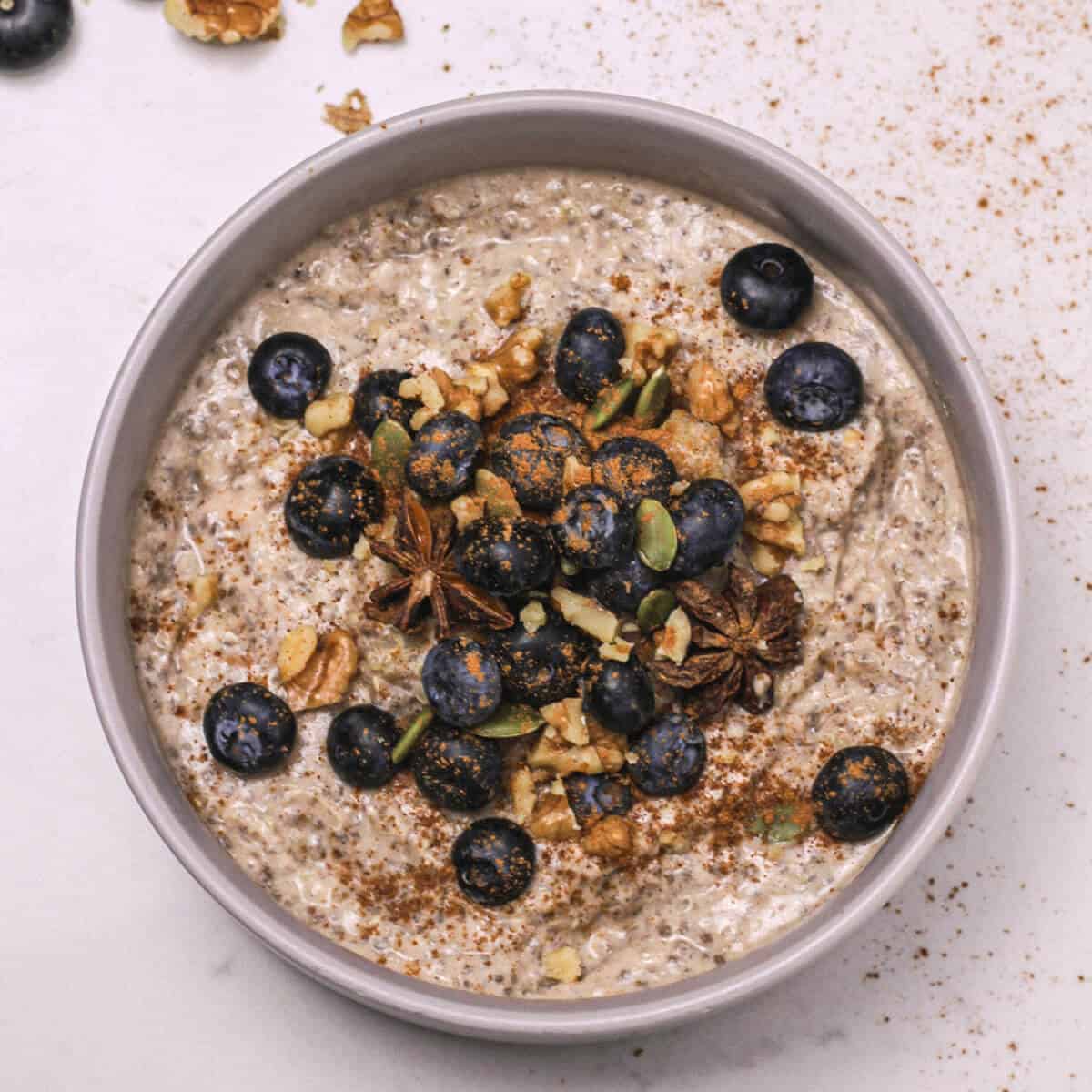 Quinoa porridge in a bowl with berries and nuts